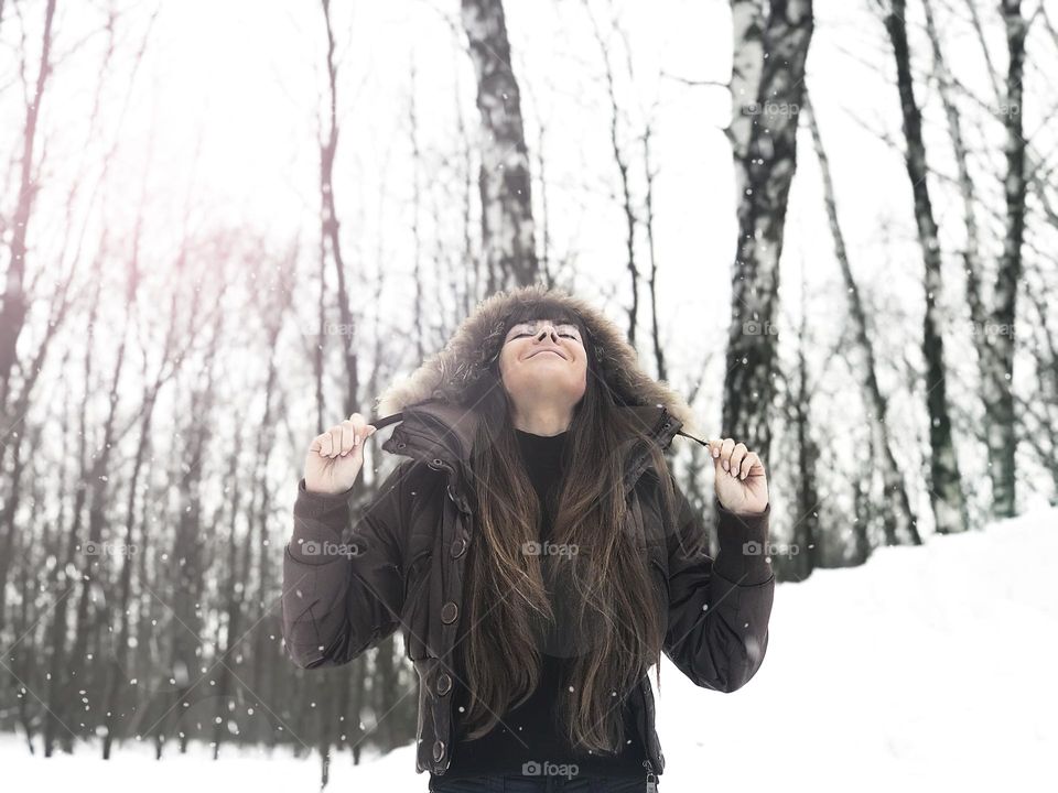 Happy under falling snow 