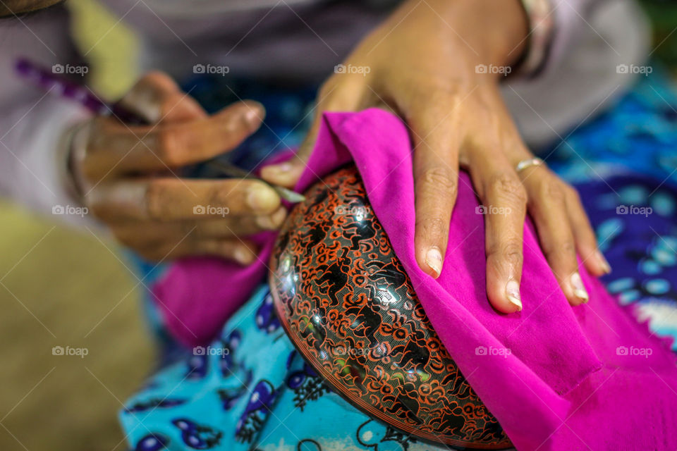 Close-up of a woman designing fabric