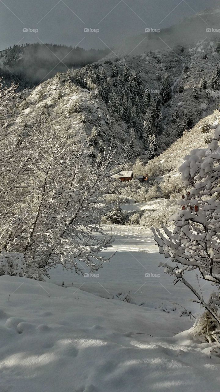 Breathtaking scene on a pristine snow covered high mountain valley.