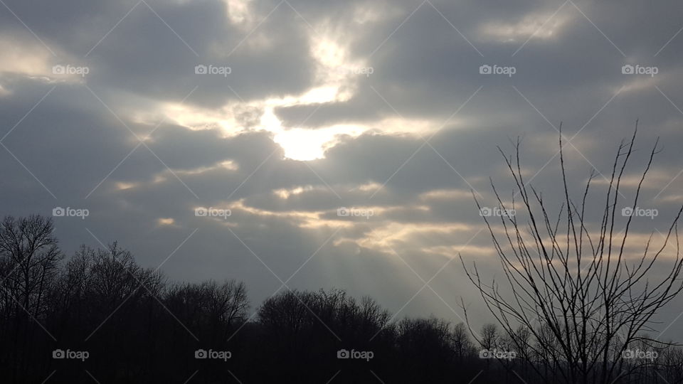 sun rays through the clouds
