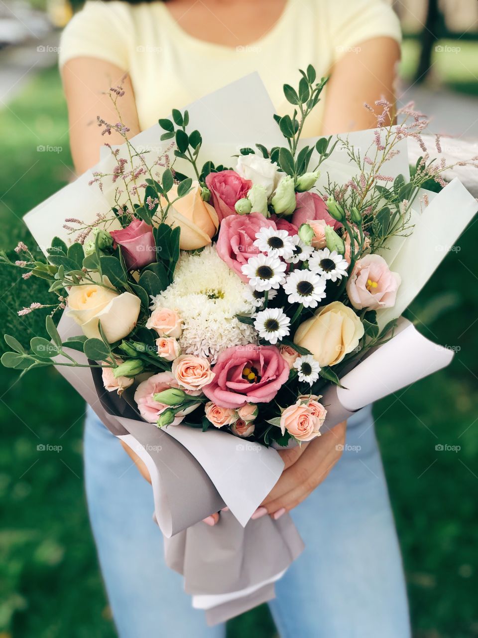 Beautiful bouquet of flowers in woman hand