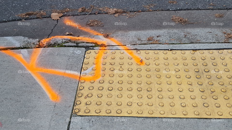 yellow sidewalk texture thing with construction marking