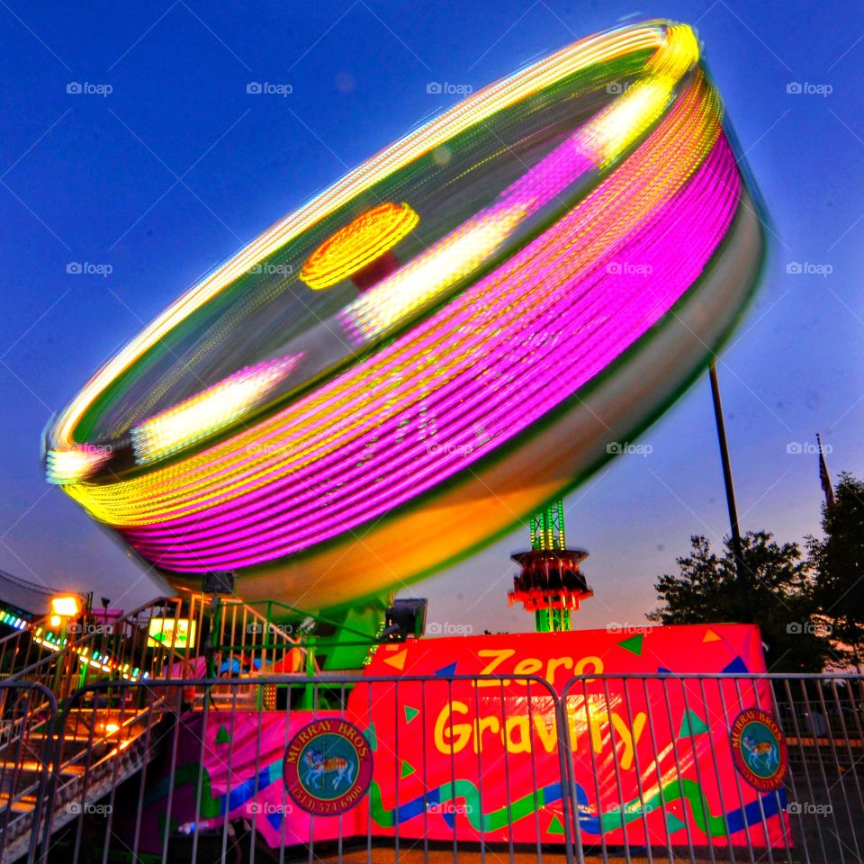 Beauty in motion. Night time excitement, amusement park rides. 