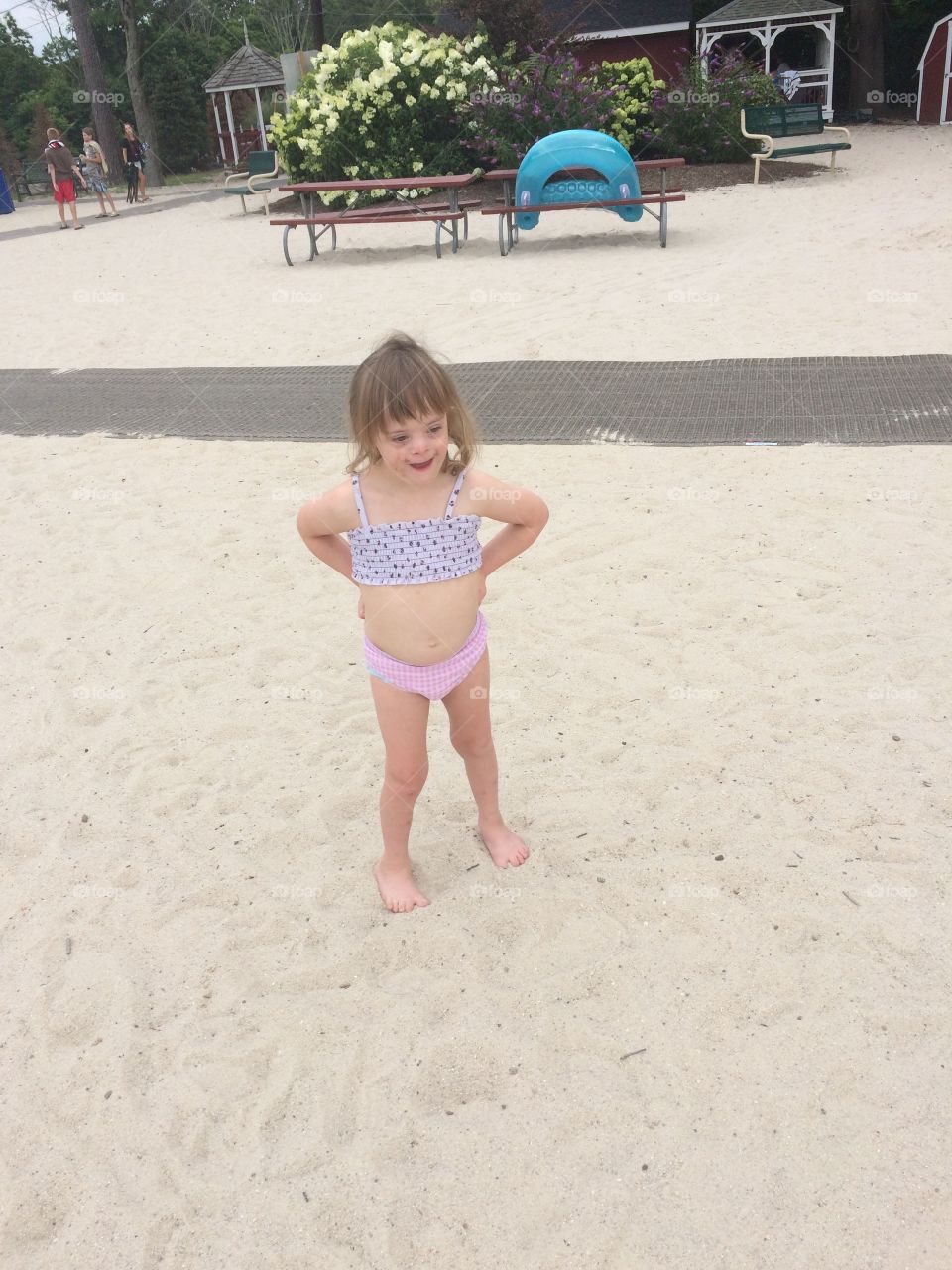 Little girl with Down syndrome on beach