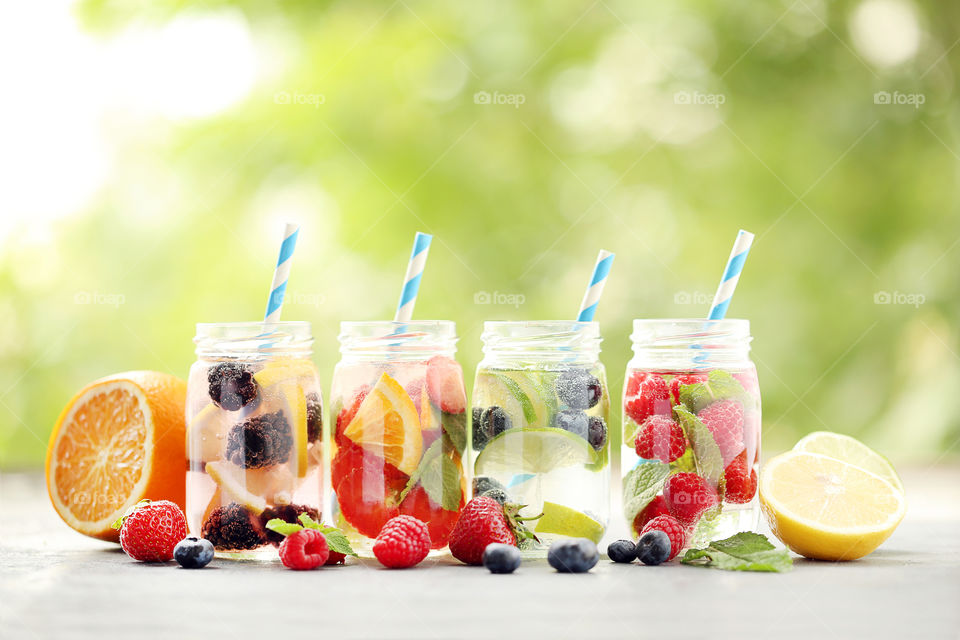 Colorful summer water drink with berries