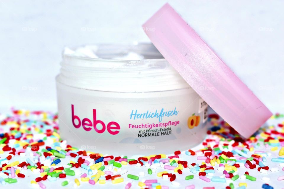 Soft peach cream surrounded by sugar sprinkles.