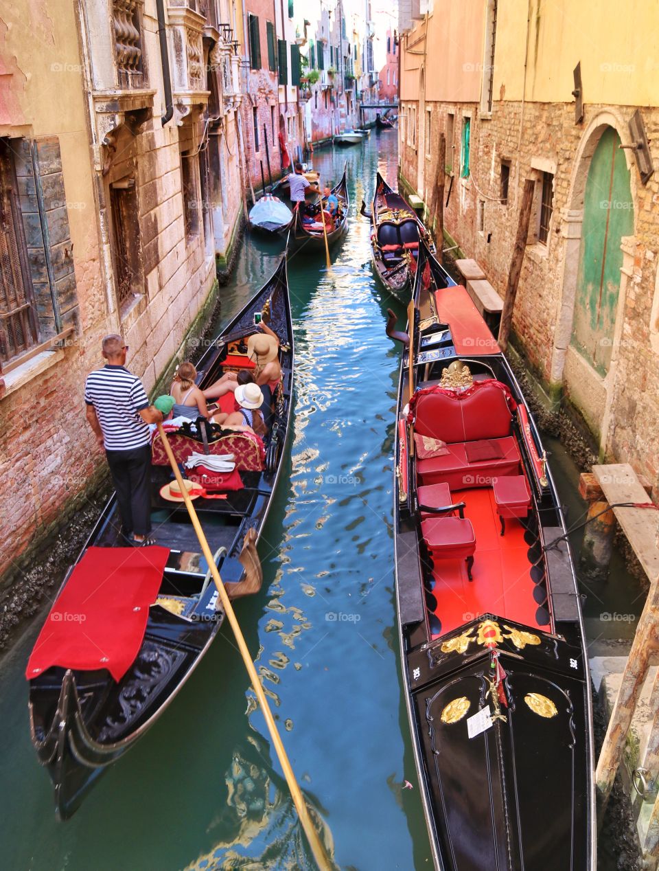 On a gondola along the canal of Venice