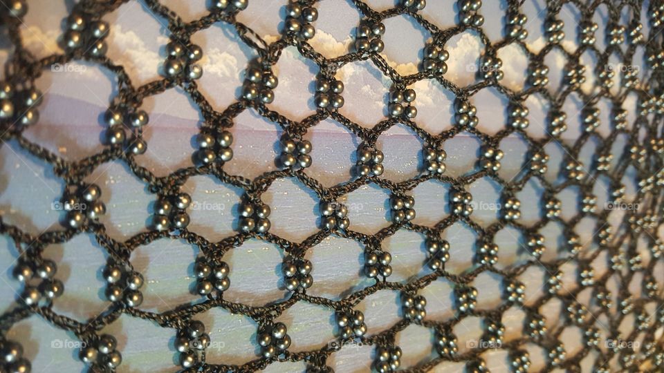 Beaded netting artwork