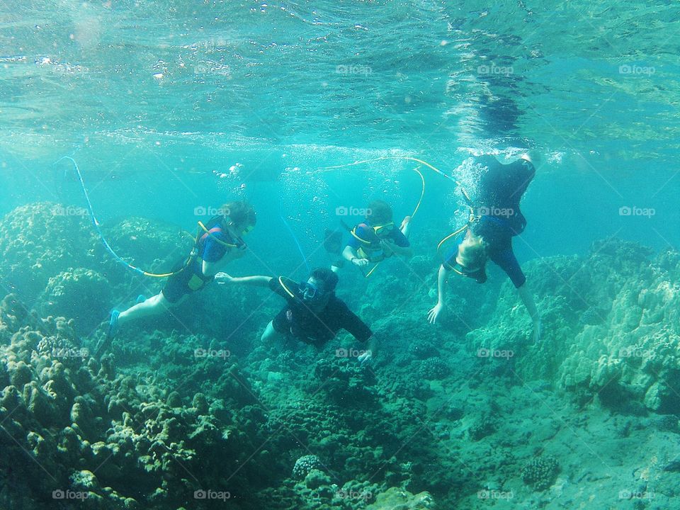 Father Scuba Diving With His Kids