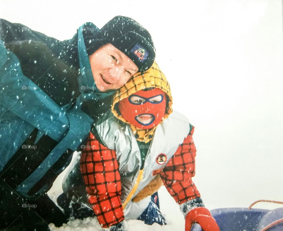 Woman with person wearing costume in snowy weather