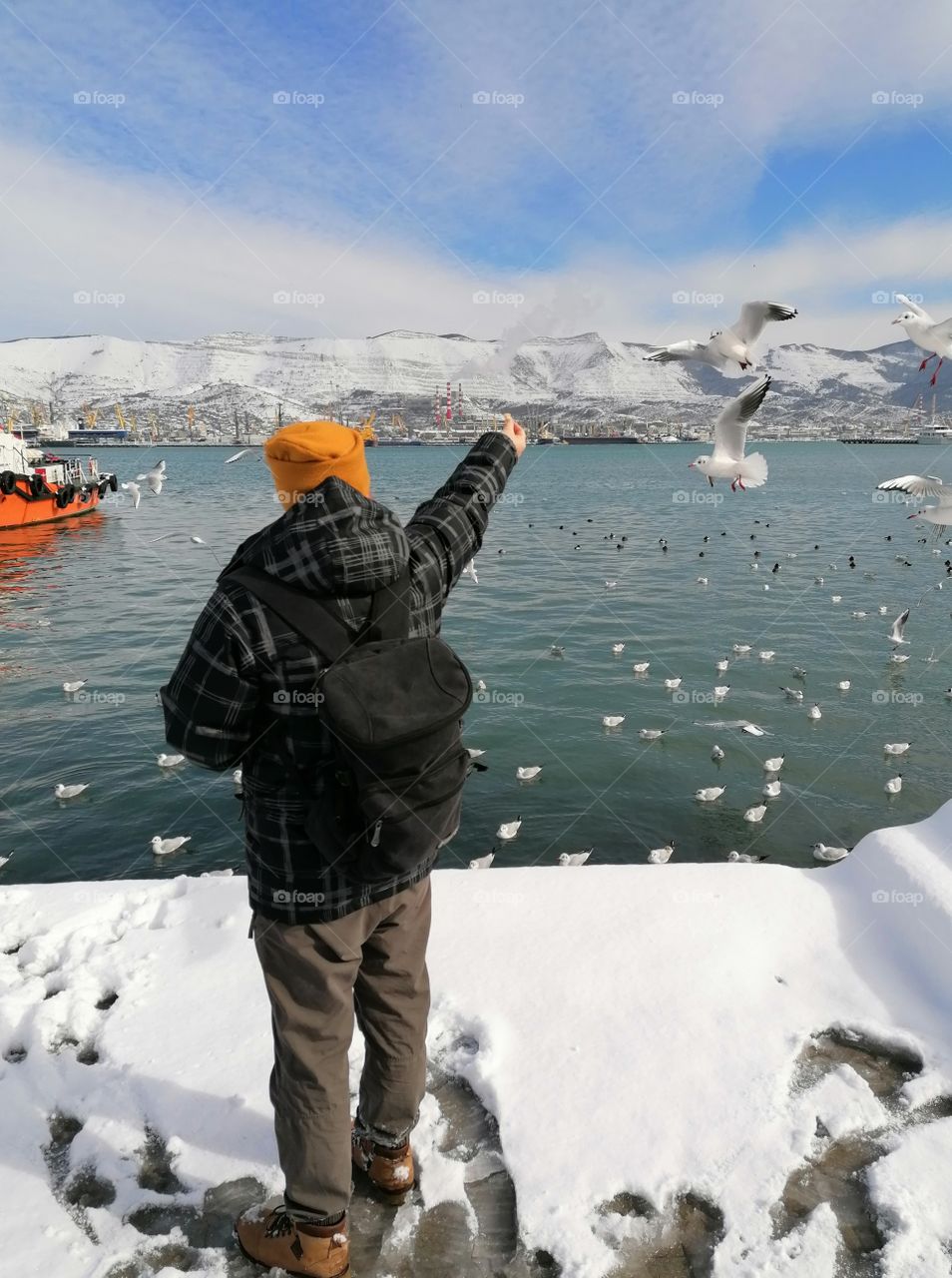 We love to walk along our embankment in the city of Novorossiysk and feed the seagulls