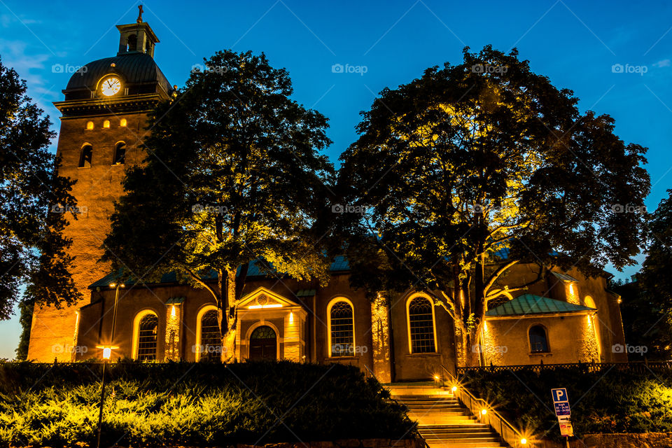 a long exposure photo of Caroli church in the city of Borås Sweden