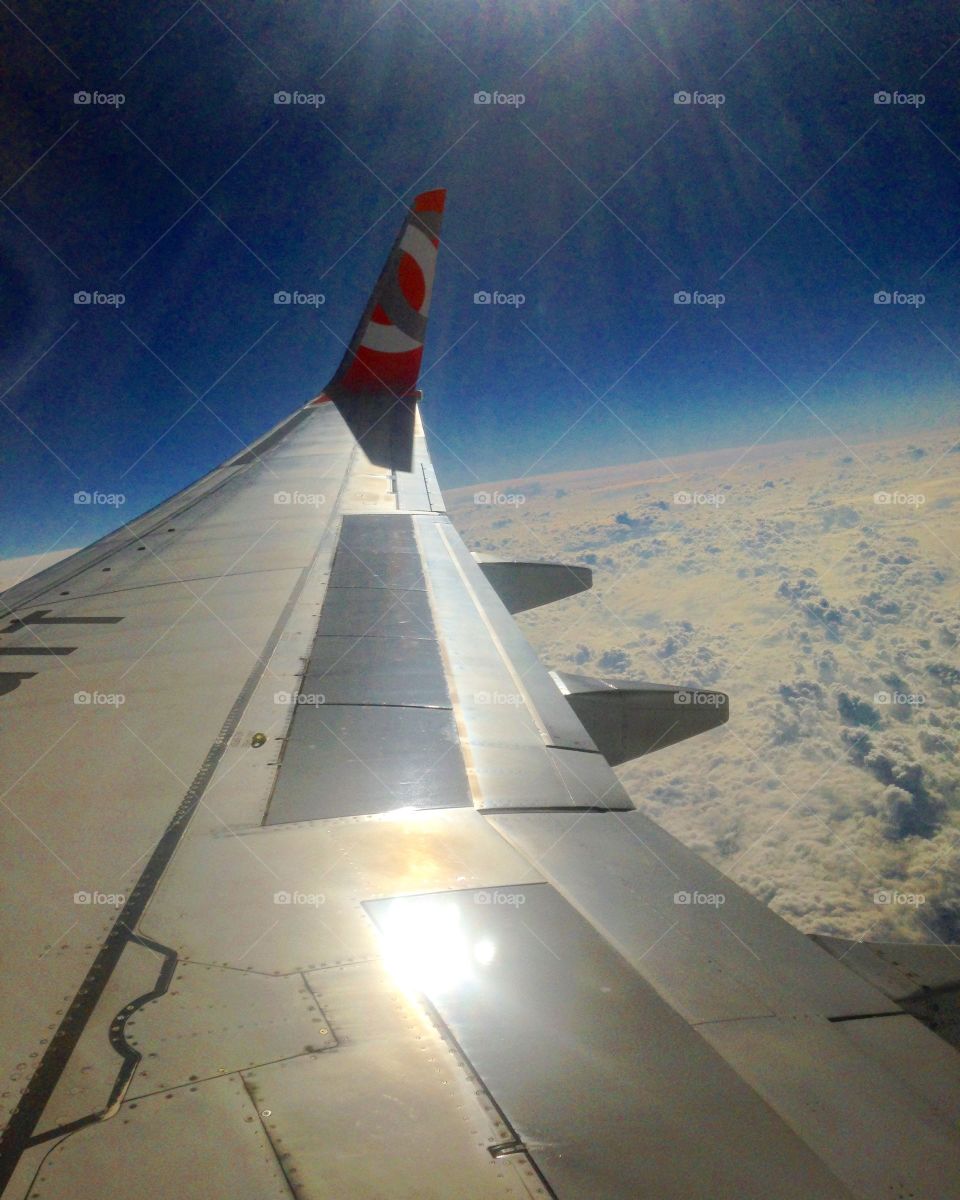 Airplane wing sky Earth clouds Gol airlines sun day flight