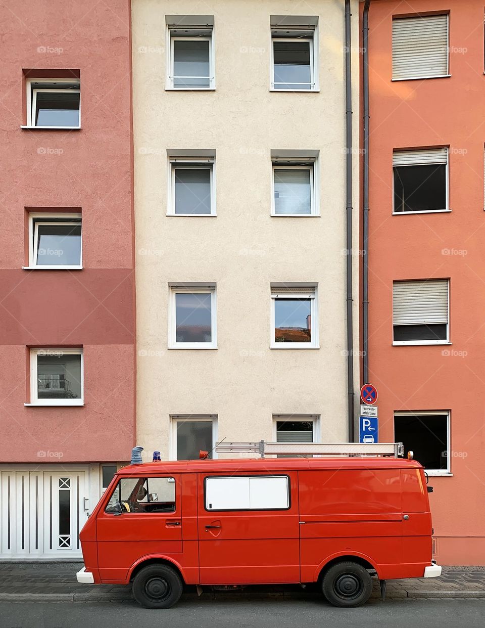 Red retro car in the city 