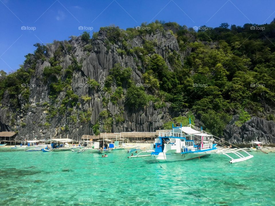 Clear sea waters over mountain range