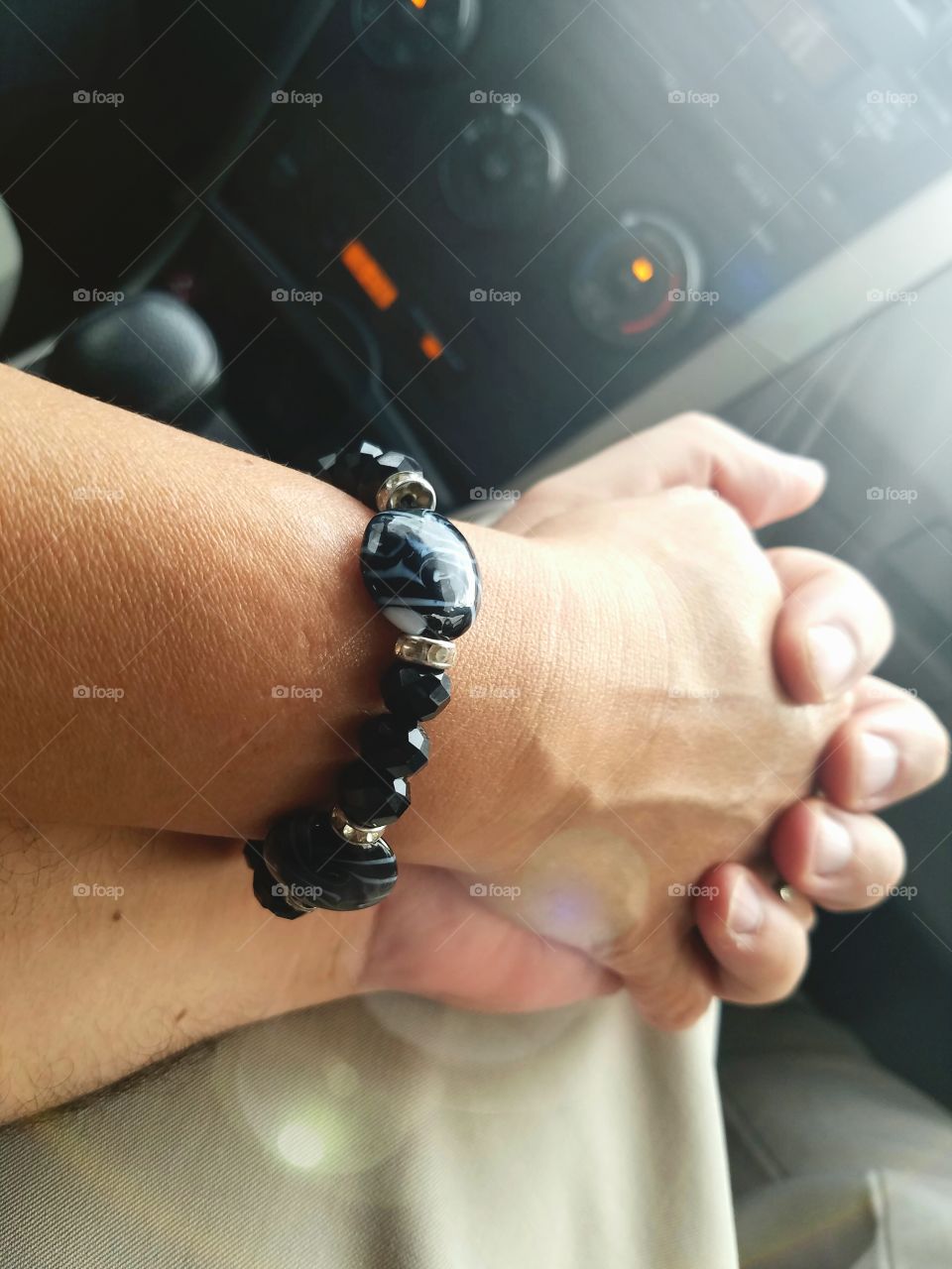 Holding hands with handmade bracelet