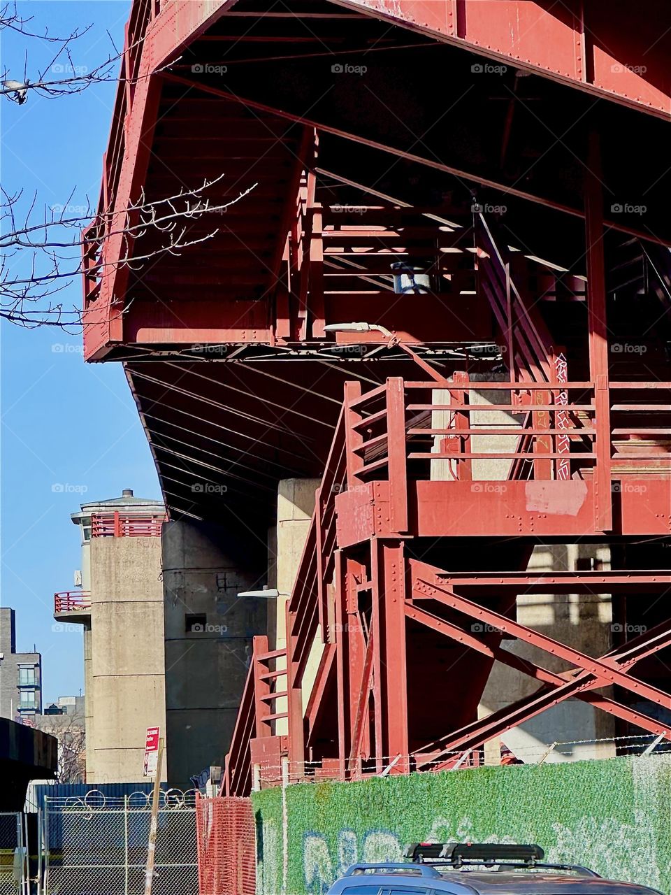 This is the red metal staircase of the “Pulaski Bridge” at “Newtown Creek” on the “Greenpoint”, Bklyn side. The variety of detail this marvel of modern design presents is sheer endless. Shadows cast add to the patterns. 2023. Hypnotic Productions