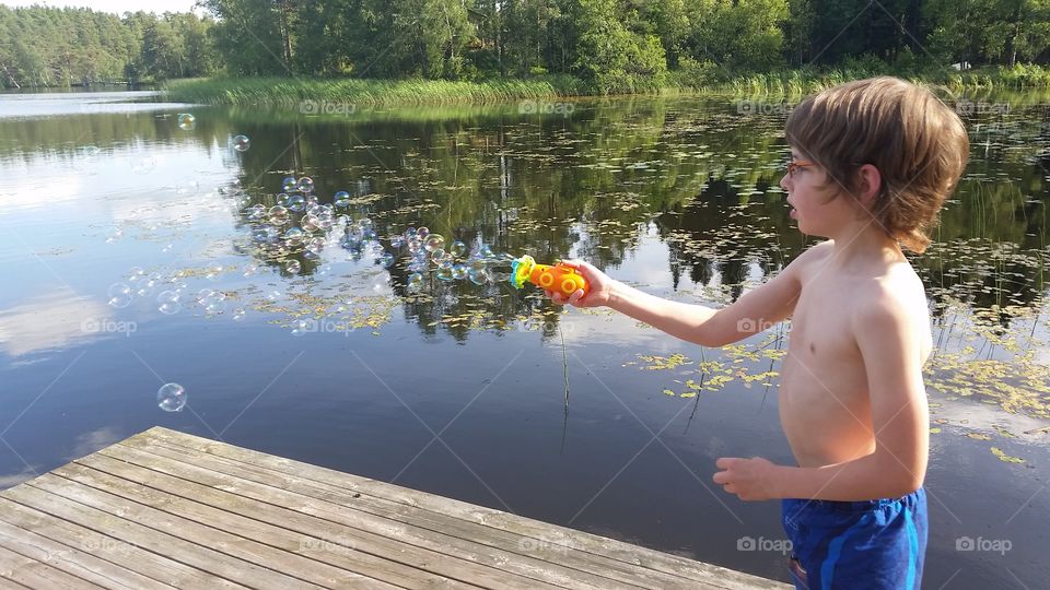 Bubble maker!. Child using a bubble maker..