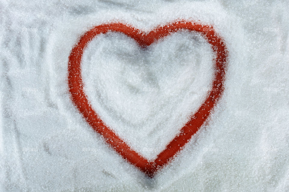 Heart writen in white sugar. minimal valentine concept