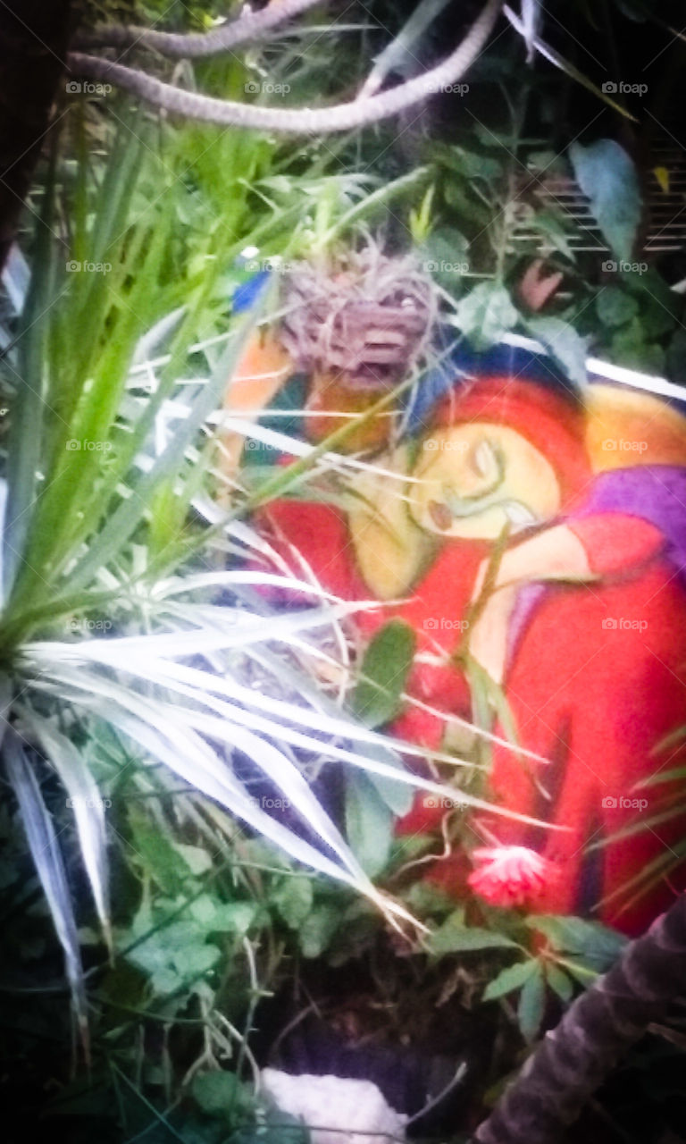 Garden decoration, full of color and contrast. Man-made Art and nature's Art combined to express communion.