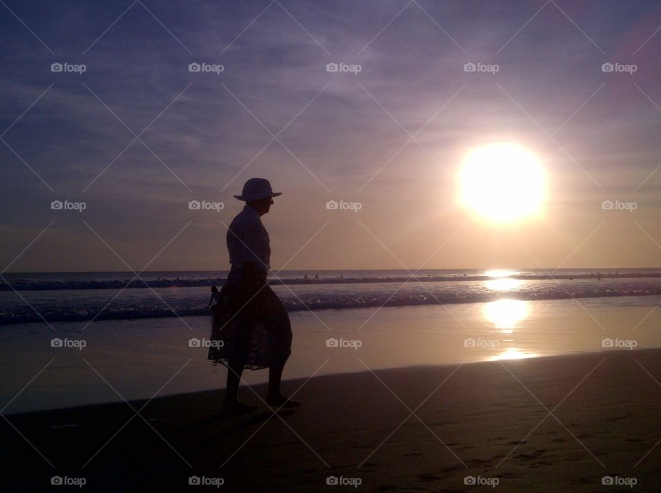 Elegance Sunset. Woman walk during sunset