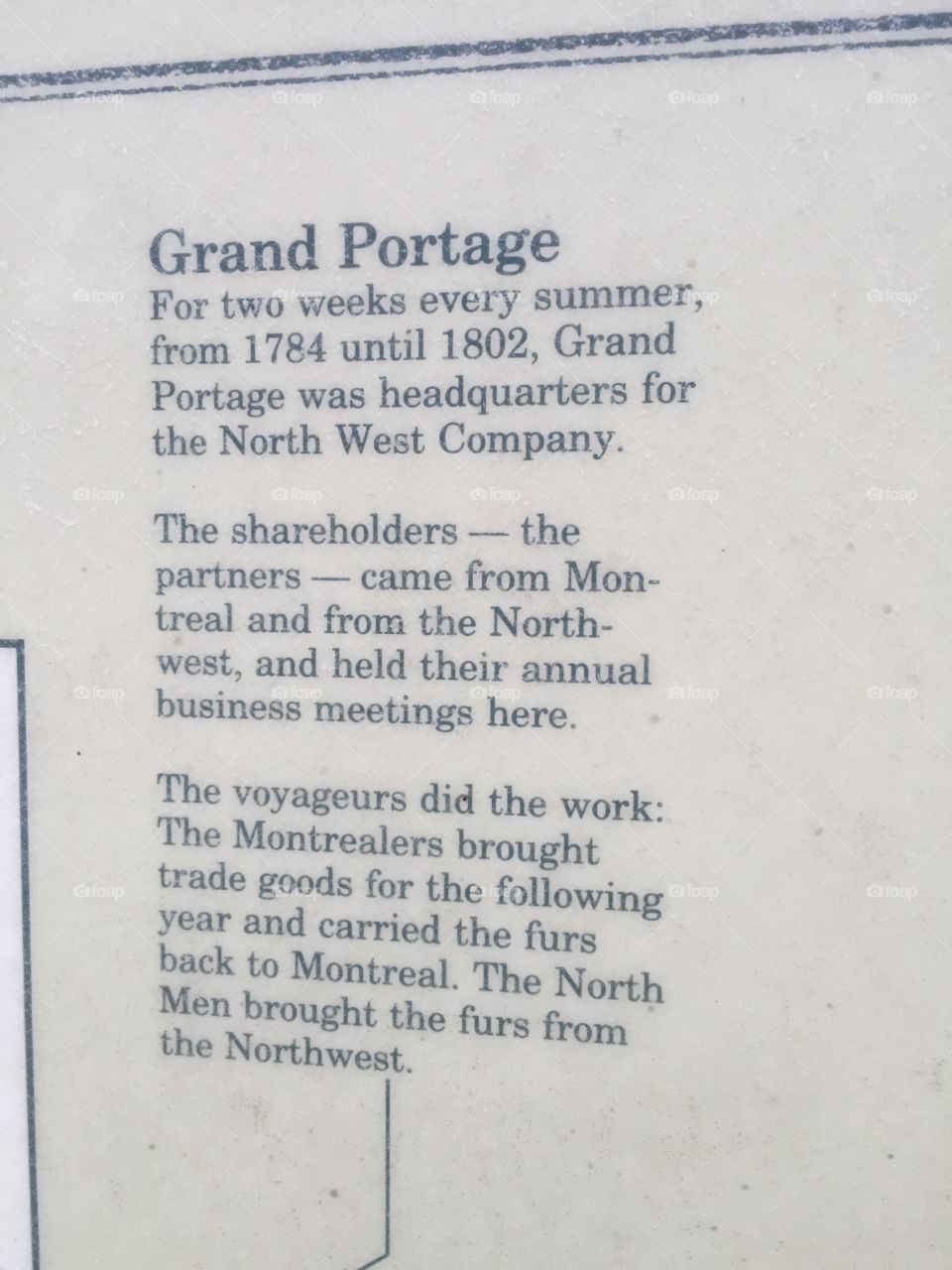 A sign explaining the history of Grand Portage.