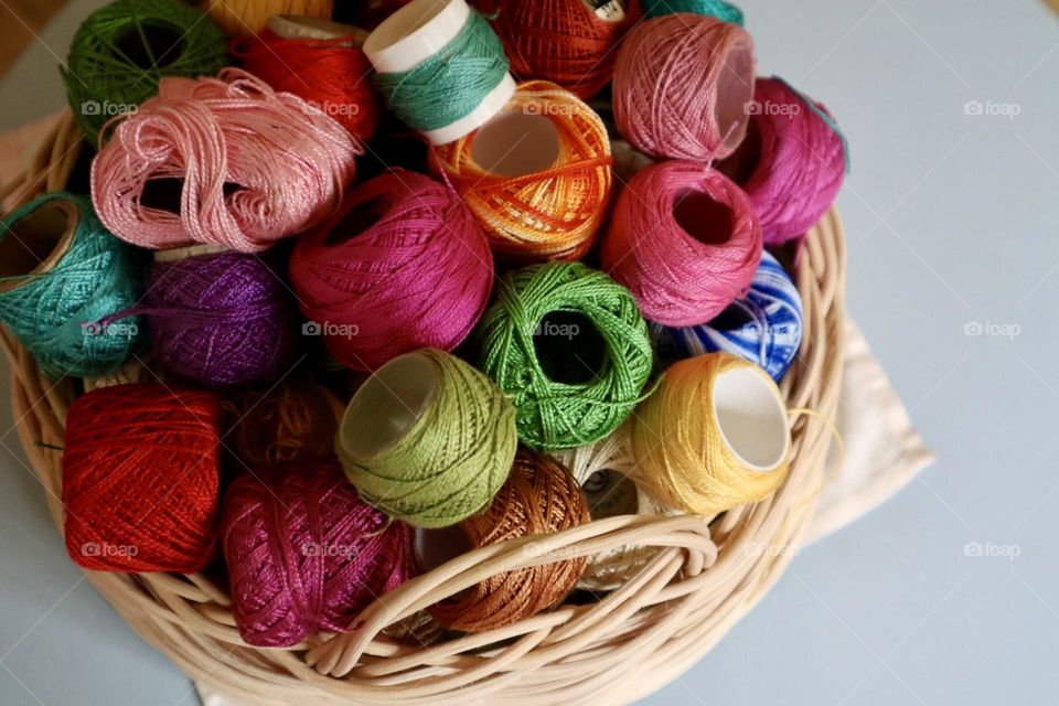 Embroidery colourful threads in a basket 