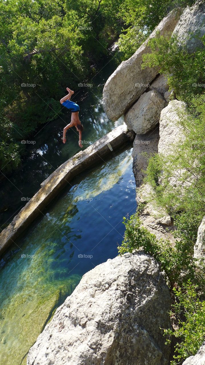 Backflip into a natural water cave