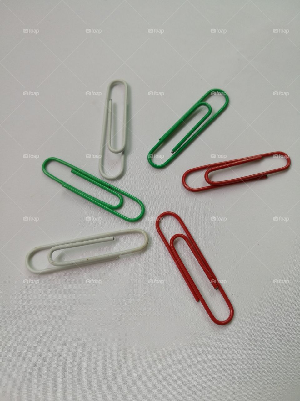 Colorful paper clips isolated on white background.