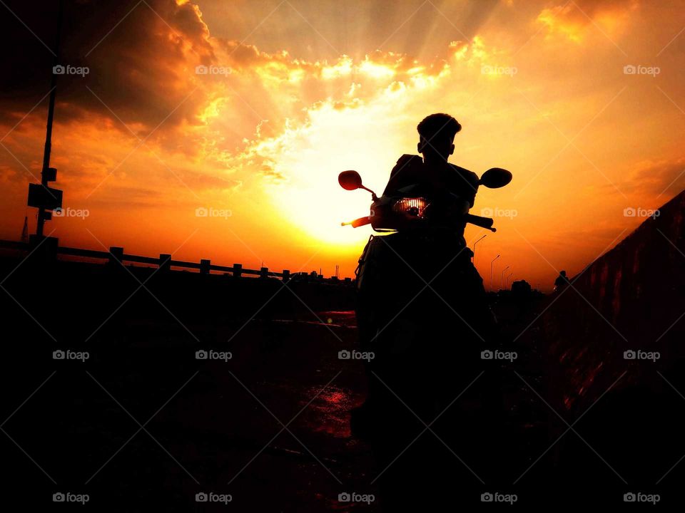 Ride before the Sunset at the bridge to click this vibrant Image