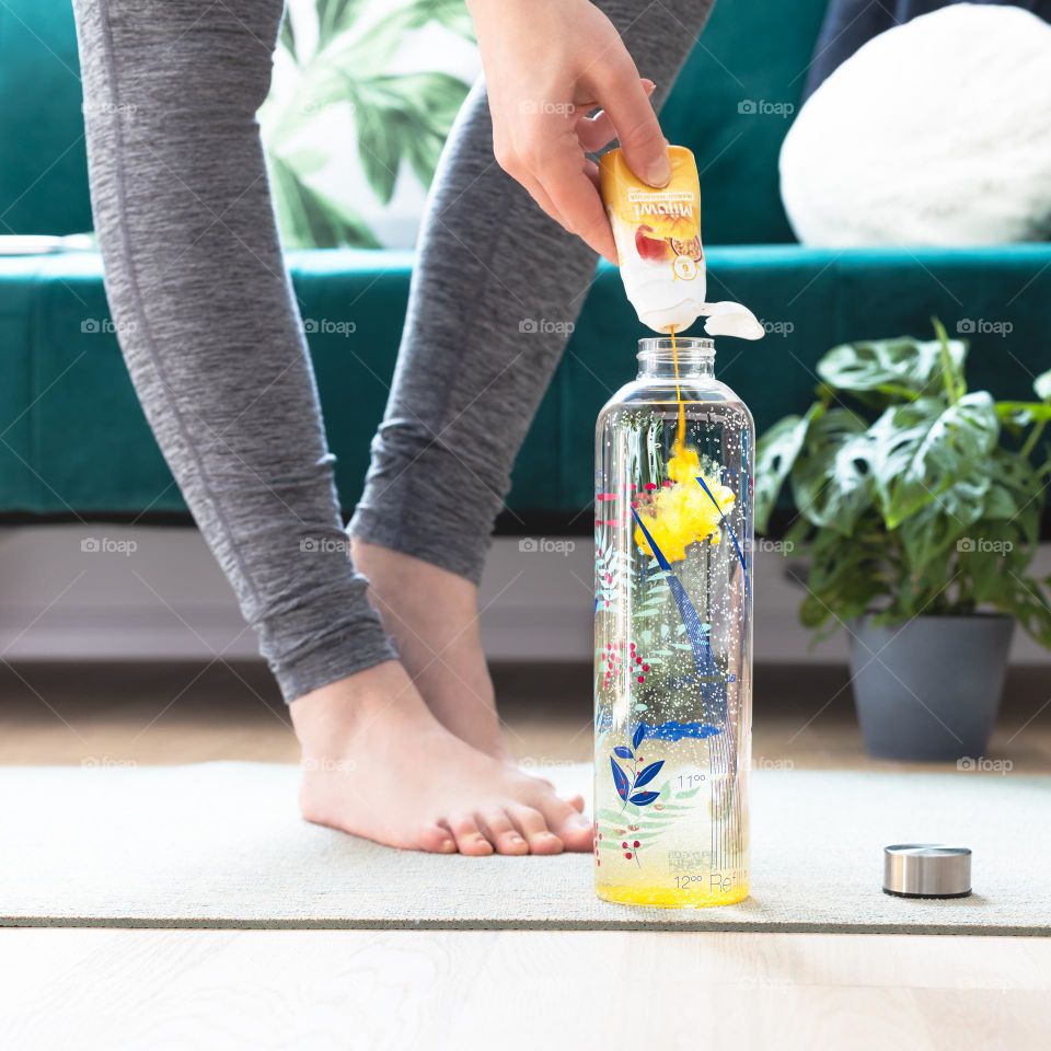 Making a fruit drink during doing yoga