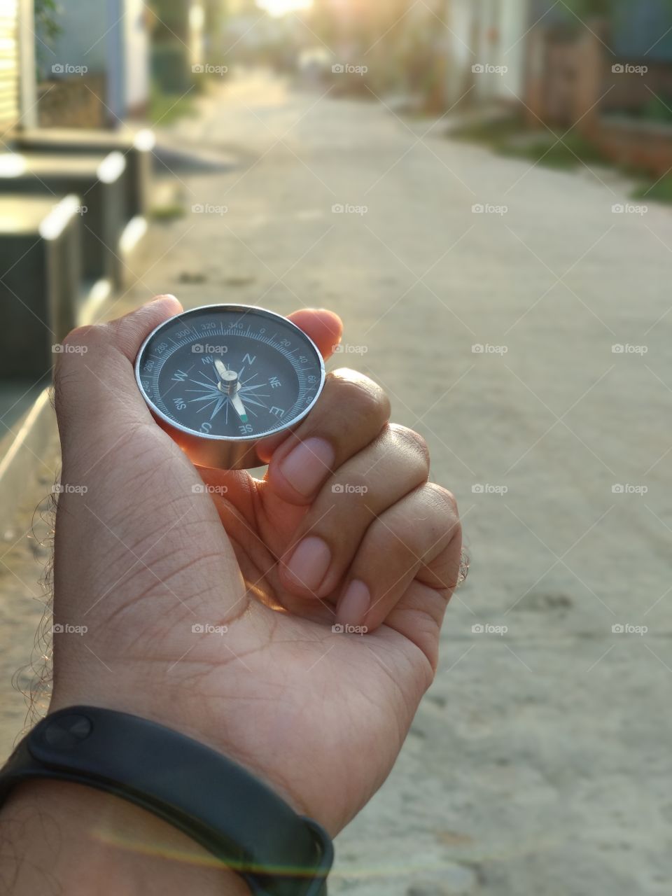 Hand with a magnetic compass. Guidance, showing way concept