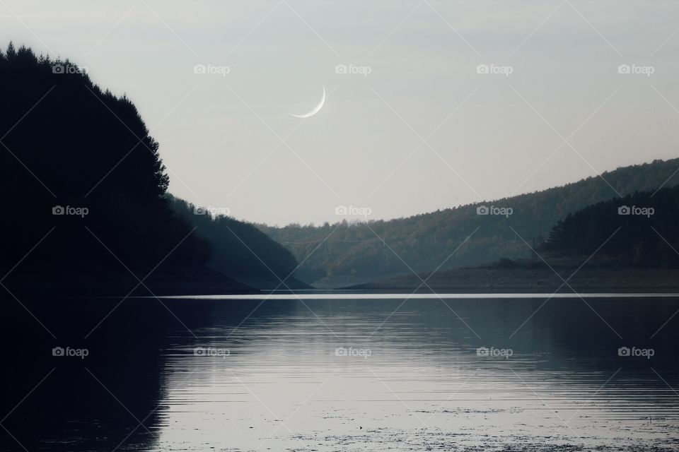 Crescent moon at the lake