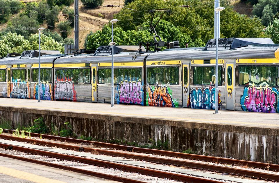 Graffitied train carriages & train tracks