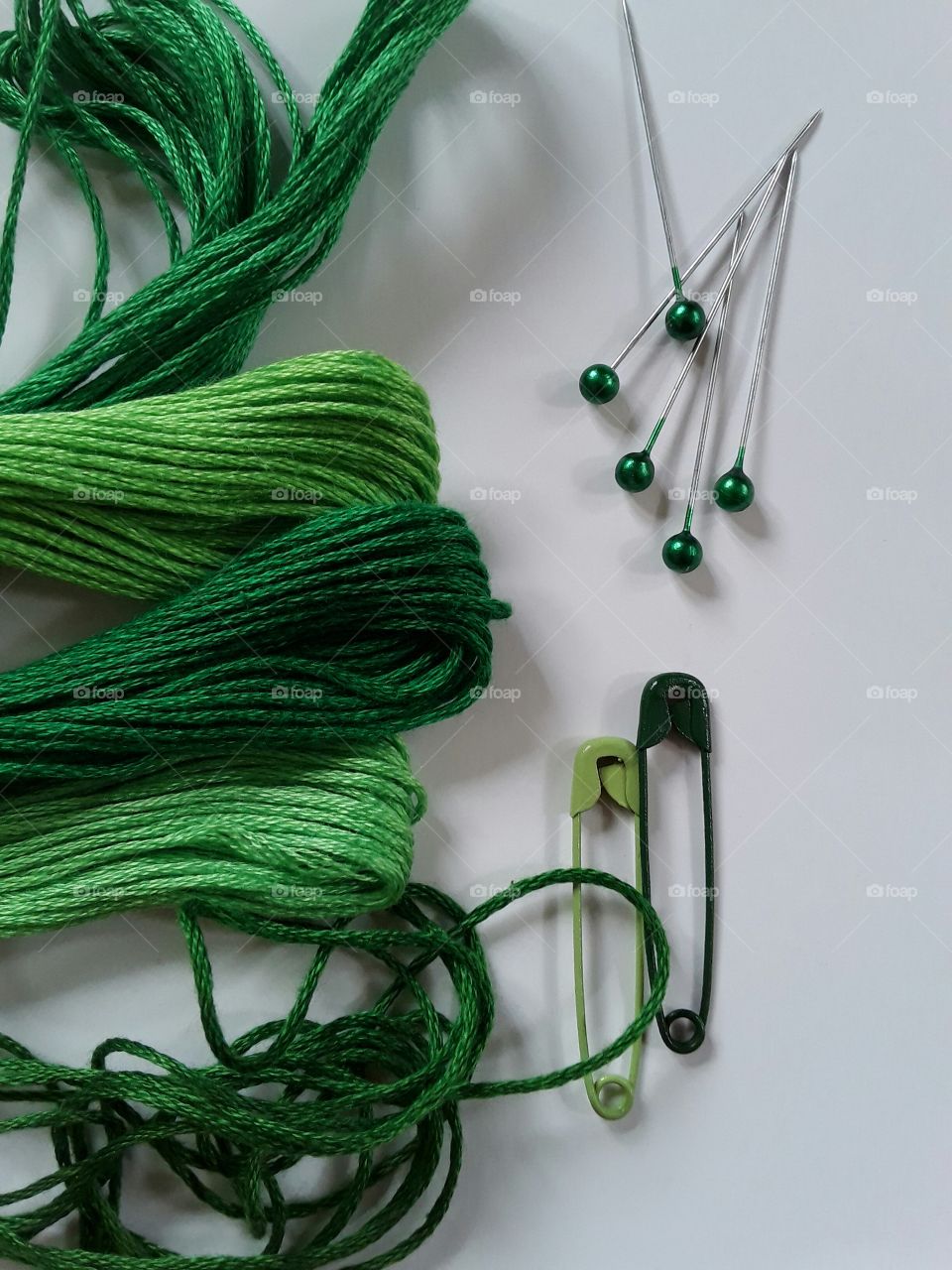 Green Colour story:thread and pins