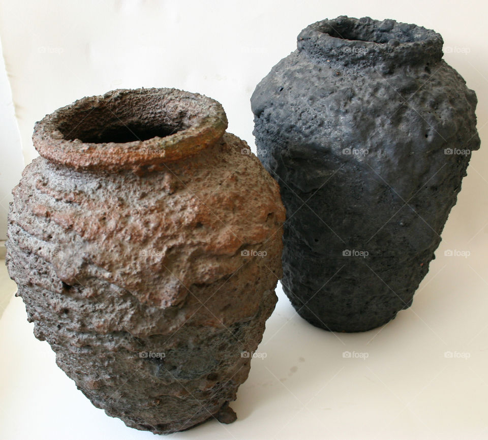 I've been working on clay bodies that look like basalt and melted lava flow.  These are my own recipes.