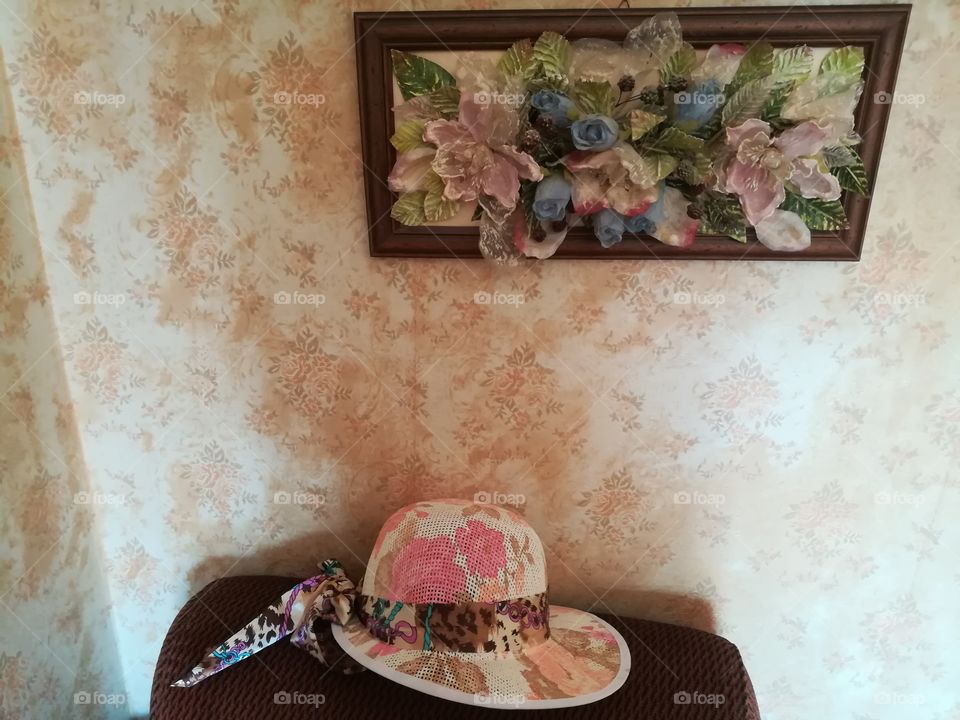 vintage apartment, three-dimensional flower frame and straw hat