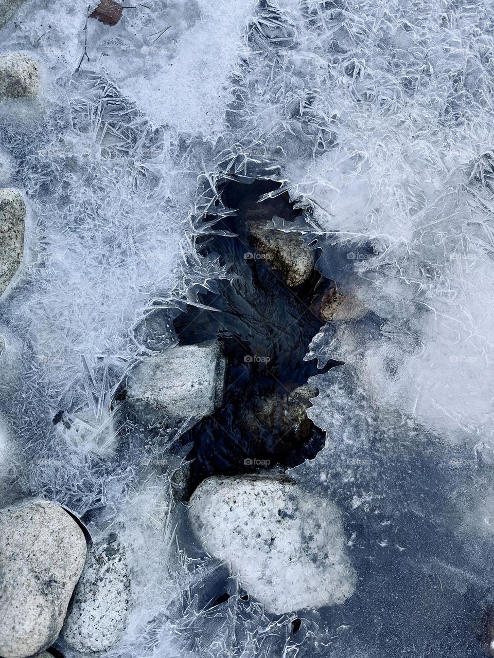 Ice drawing on a frozen stream 
