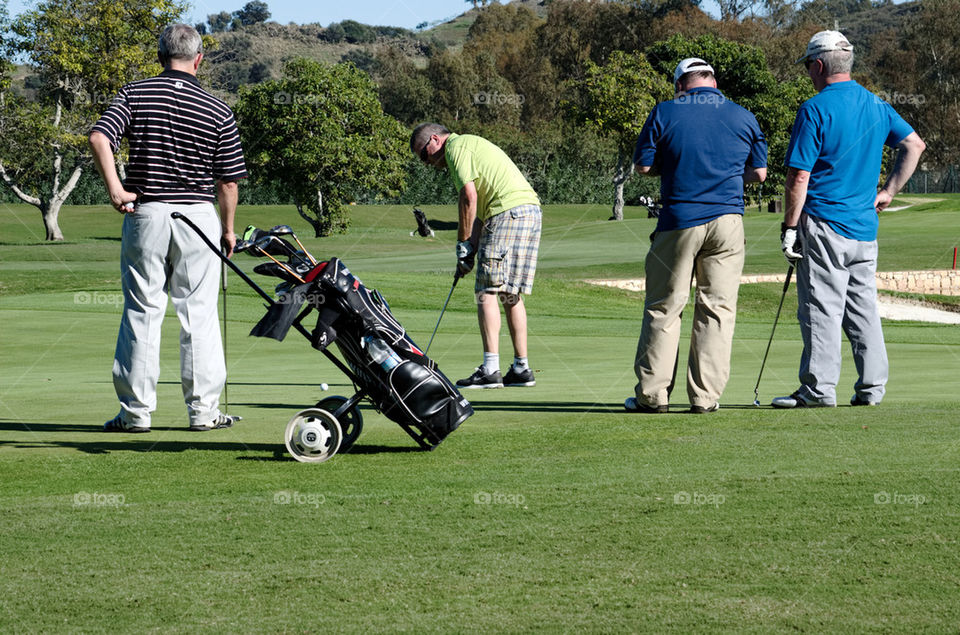 Golfers on Putting Green 