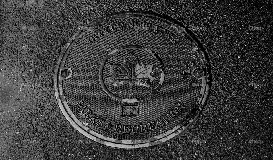 City of New York parks and recreation sewer cover in Central Park New York City