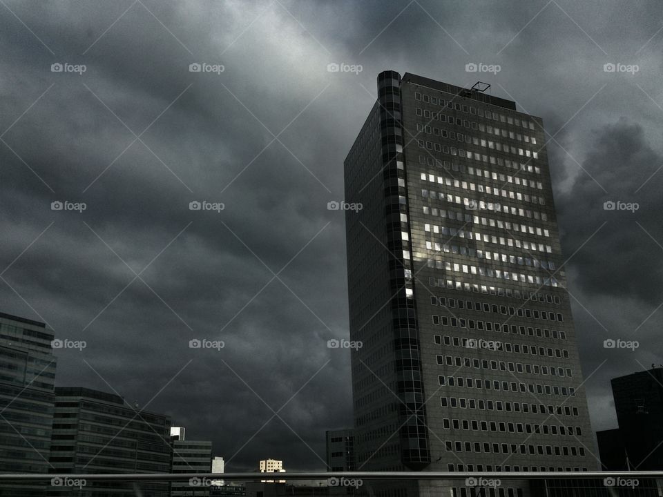 Dark cityscape . Threatening thunder on our way home 