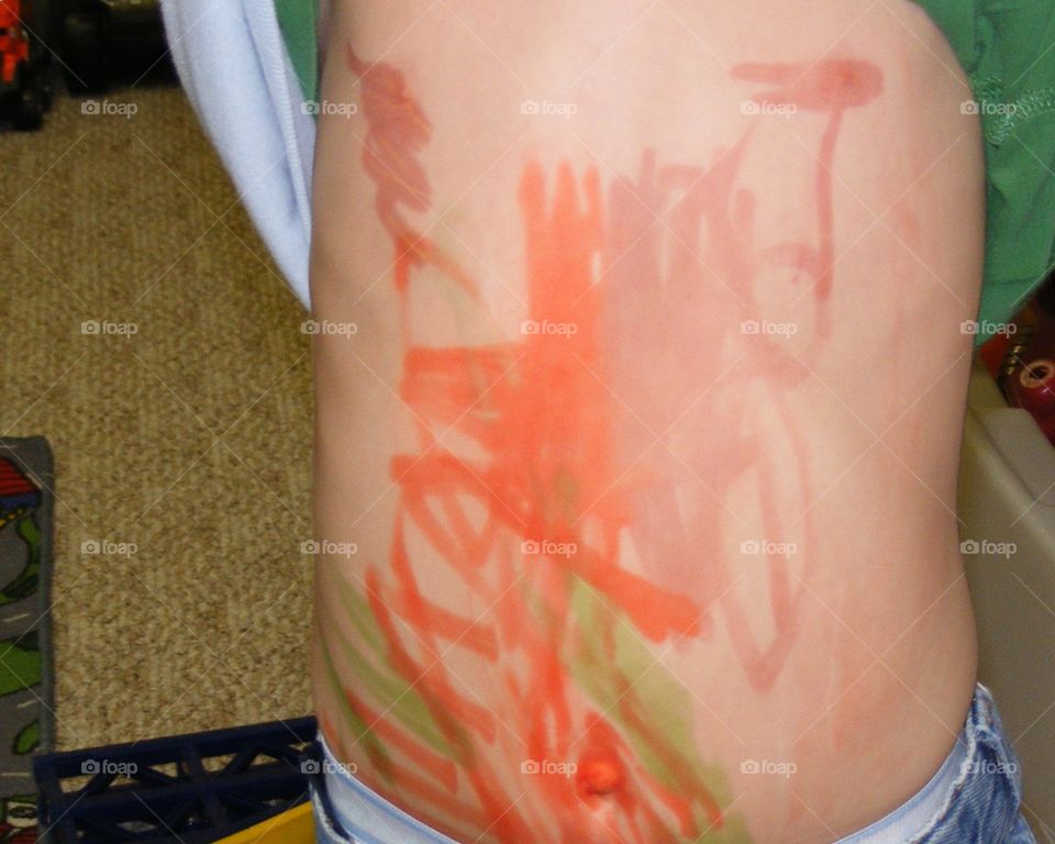 A closeup of the the marker he drew on his tummy.