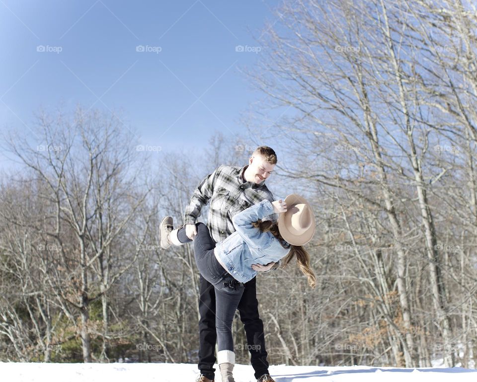 True love has twists at every turn; Man and Woman dancing on a sunny, winter afternoon