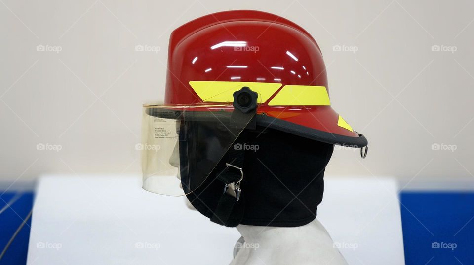 A special helmet for firefighters, this safety helmet is red