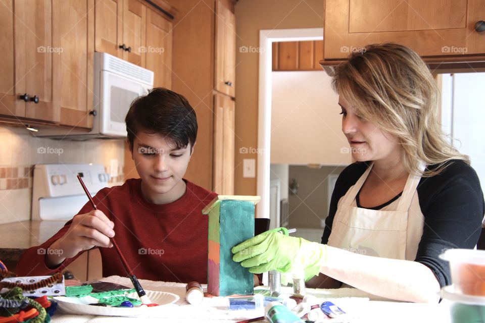 Mom and son working on arts and crafts together 