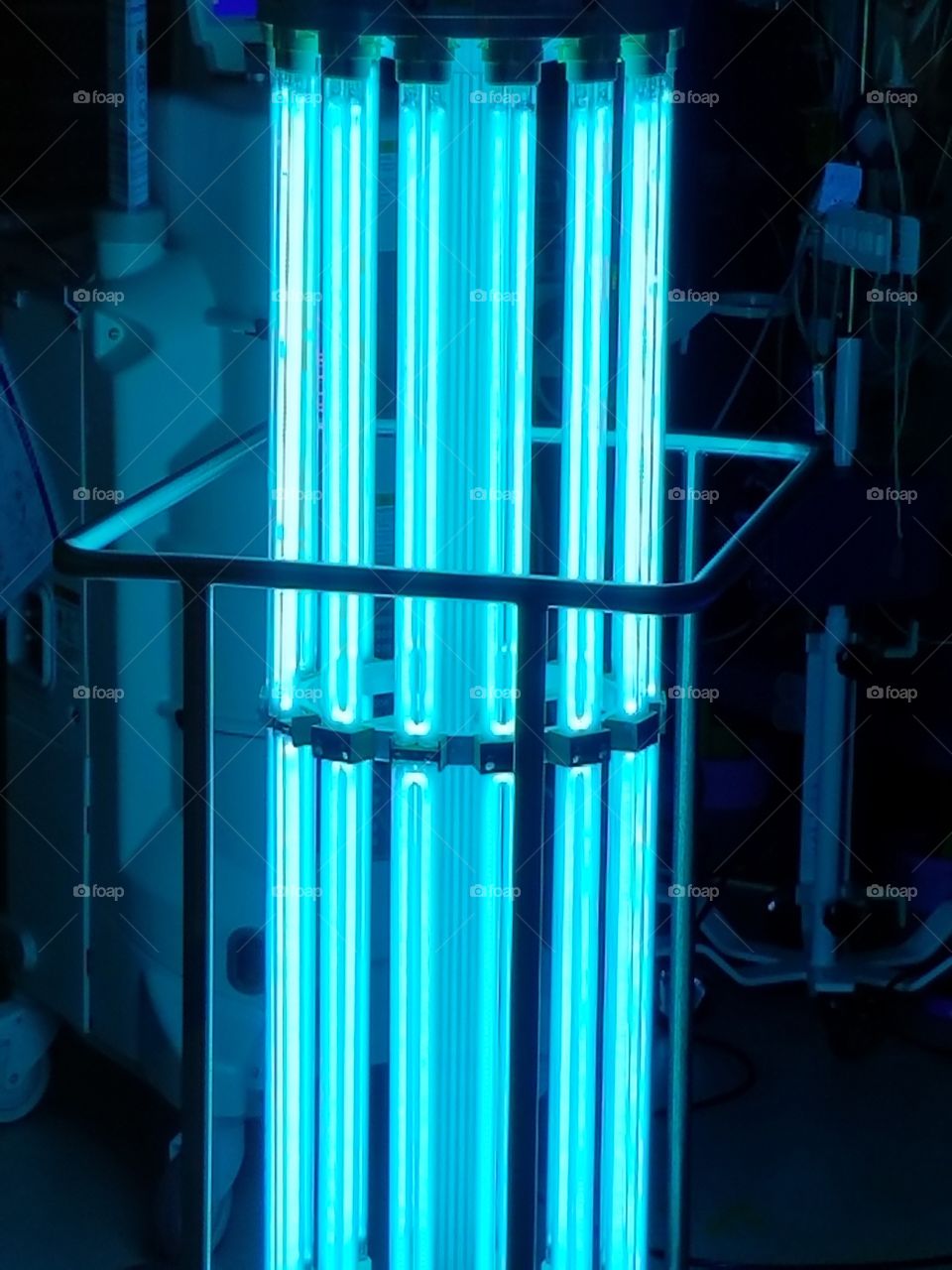 Neon ultraviolet light is used to sterilize and clean an operating room.