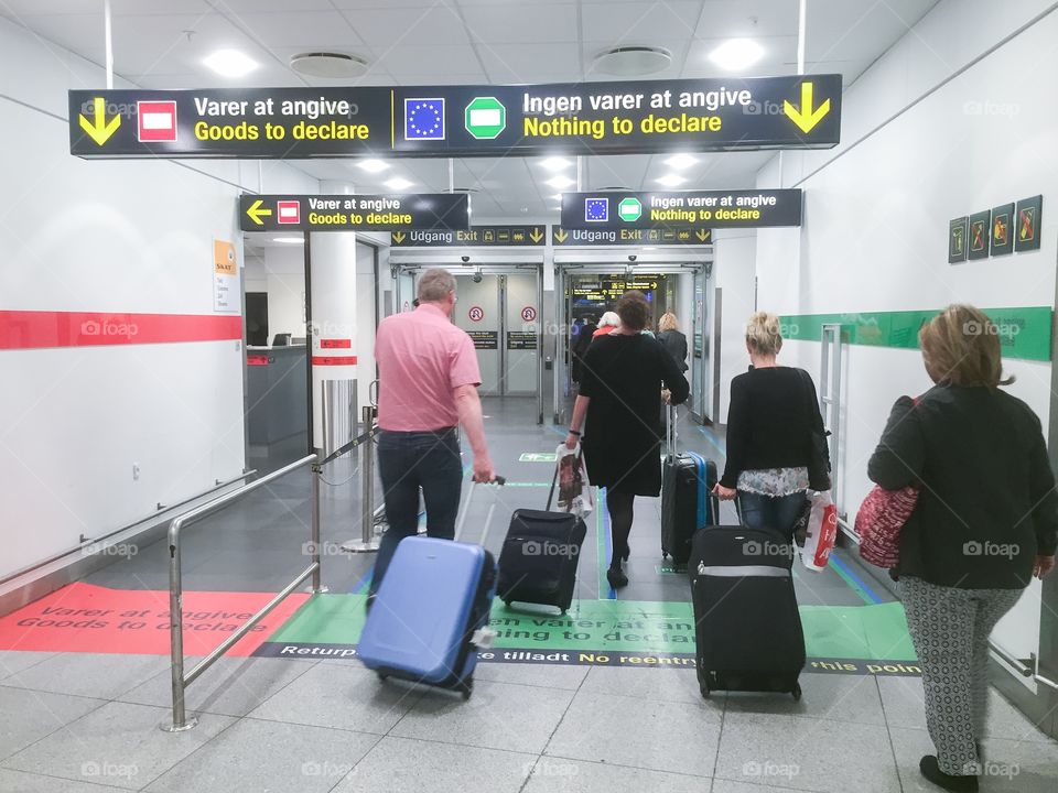 People arrive from flight at Copenhagen airport in Denmark.