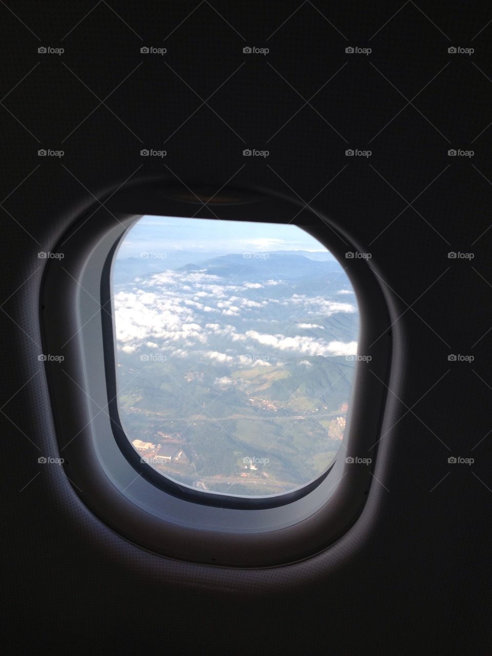 View from the plane’s window. Above the clouds 