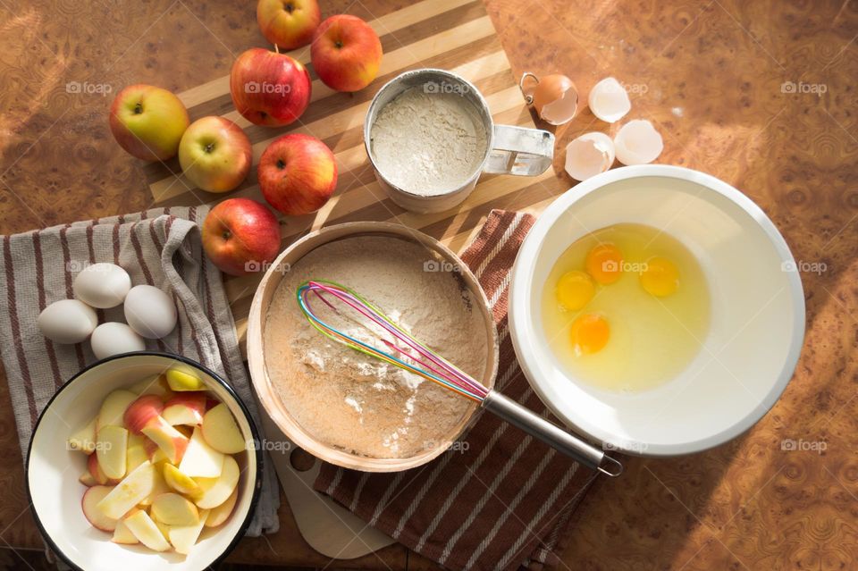 Making homemade puffed apple pie with eggs, sugar and flour.