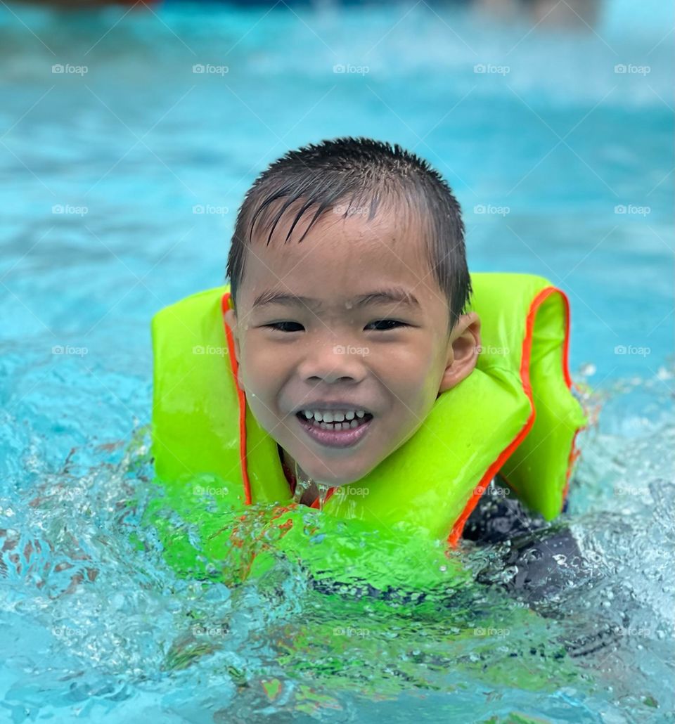 Little boy in the swimming pool!